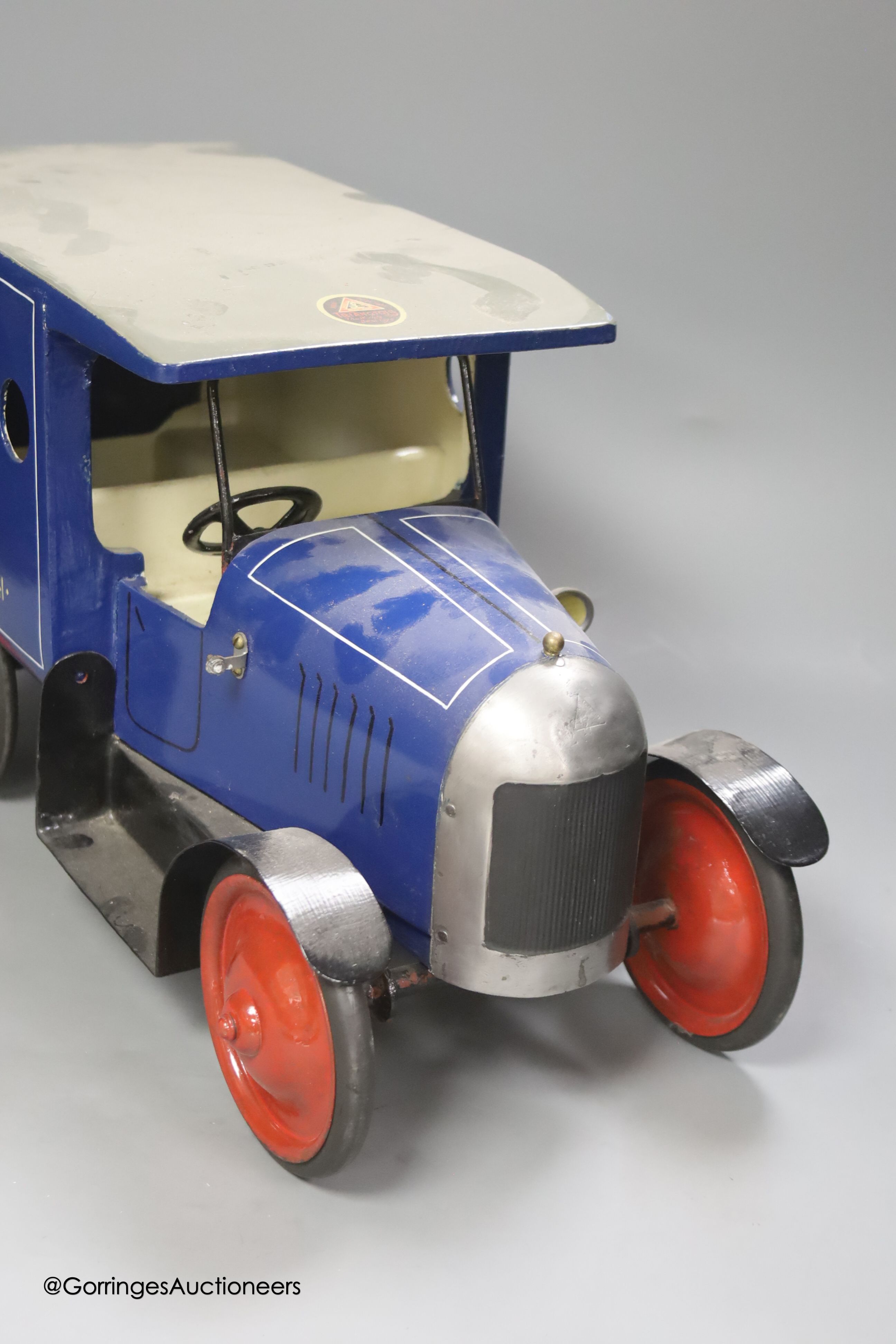 An A. Jones Butcher's painted metal model of a van, length 47cm height 25cm